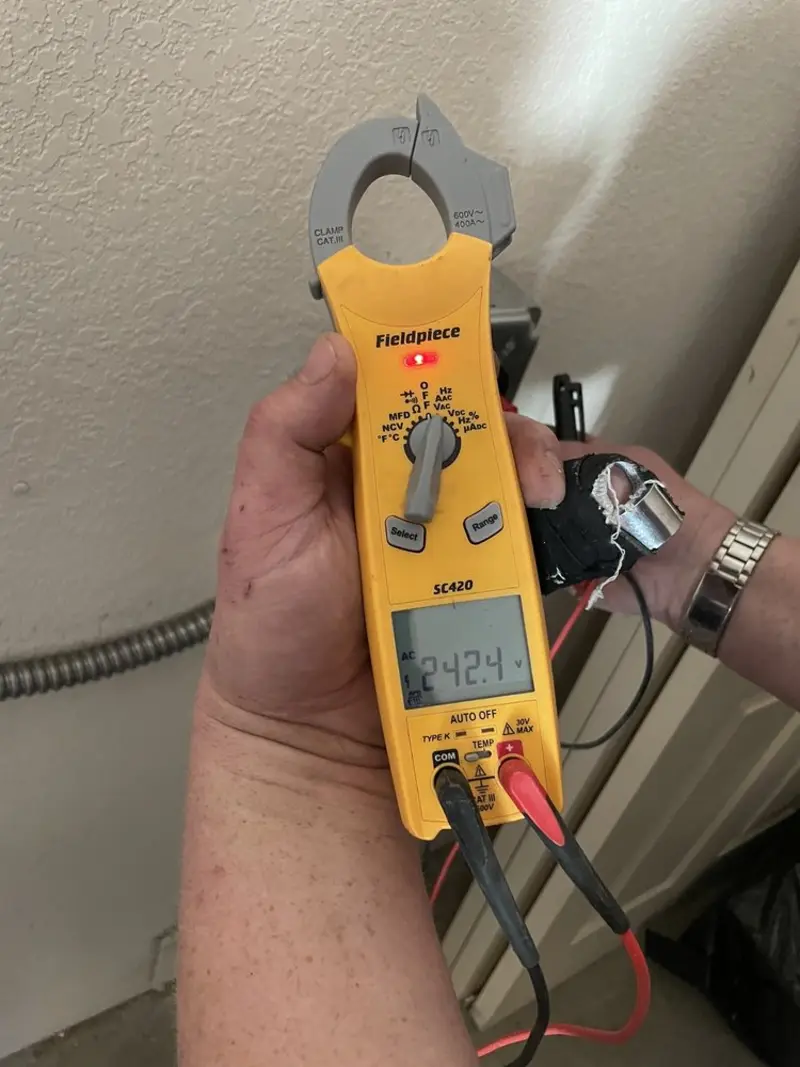 Voltage testing with clamp meter during Whole House Surge Protector in Rockport